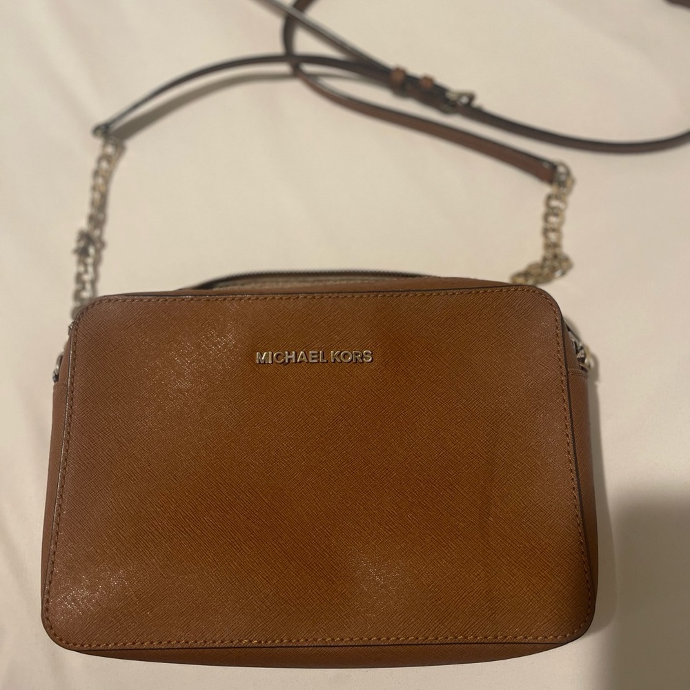 Michael Kors crossbody bag. USED. Please refer to photos and video